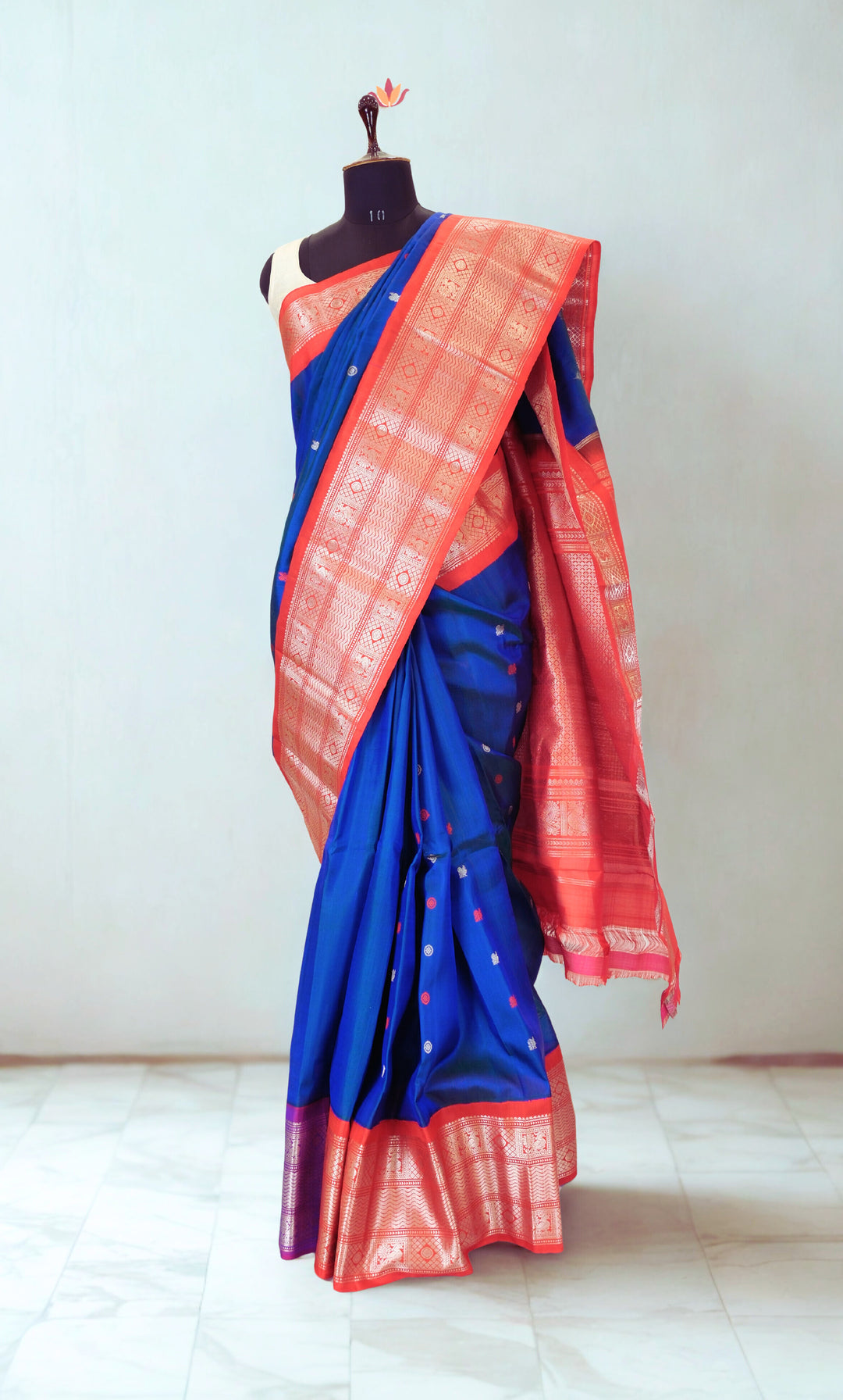 Navy blue gadwal silk saree with red contrast rich border