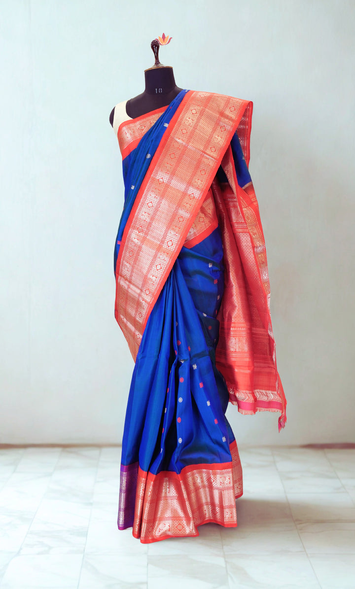 Navy blue gadwal silk saree with red contrast rich border