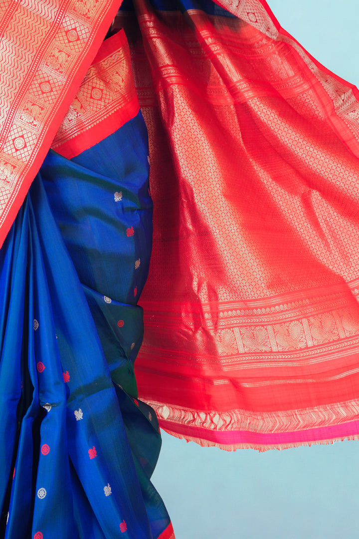 Navy blue gadwal silk saree with red contrast rich border