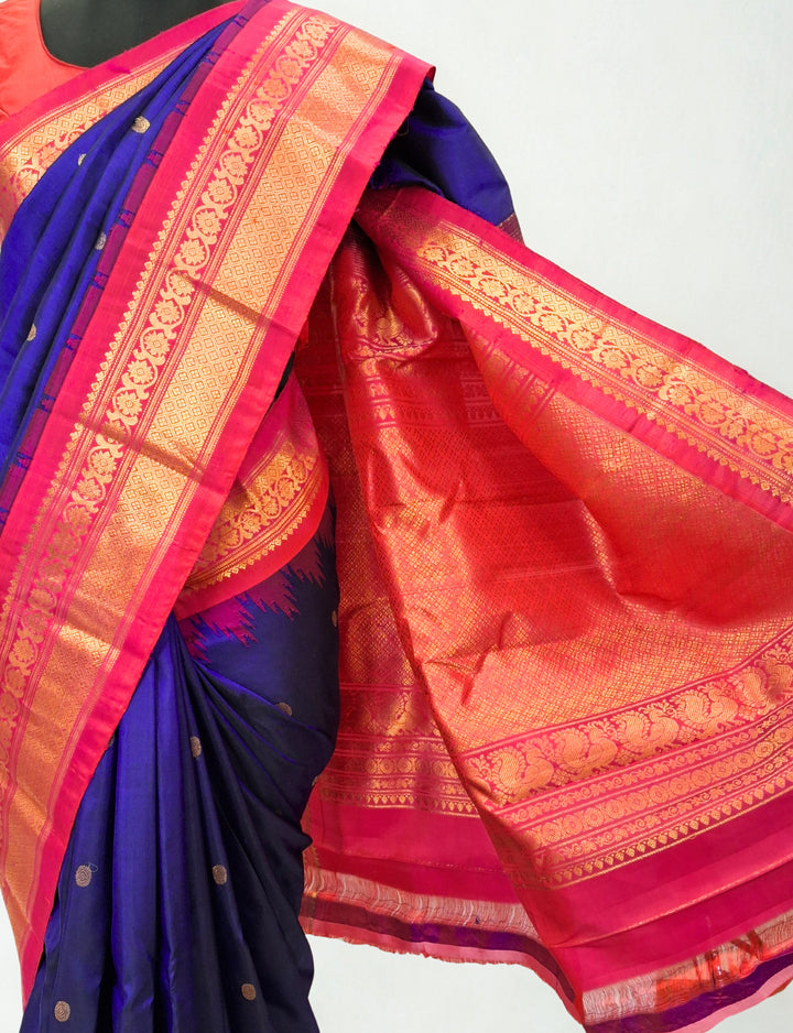 Navy blue silk gadwal saree with temple border
