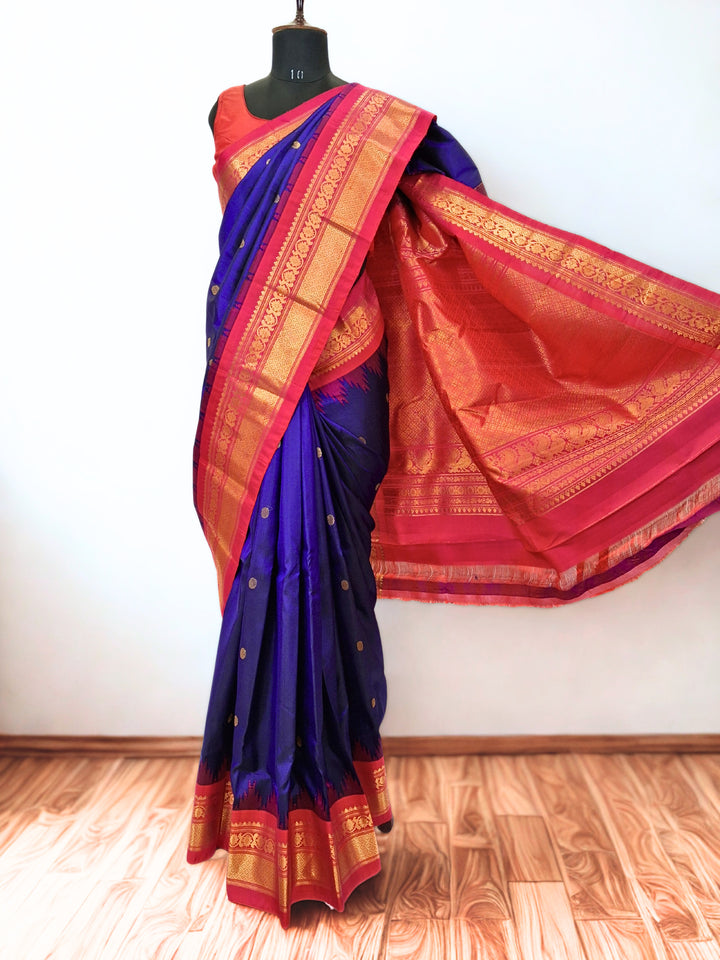 Navy blue silk gadwal saree with temple border