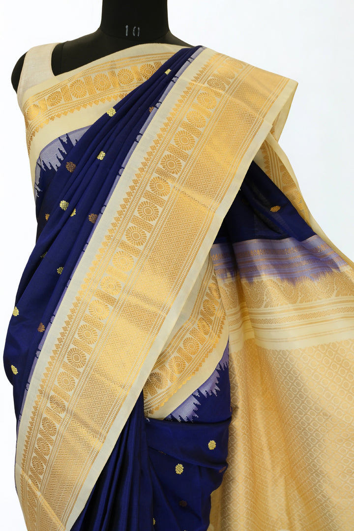 Navy blue silk gadwal saree with beige border