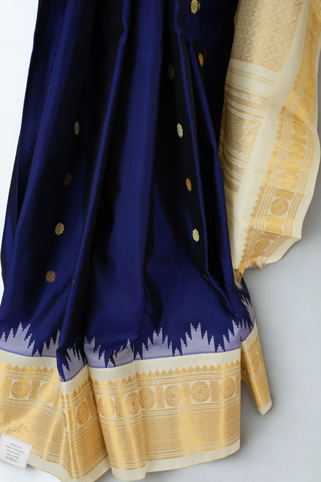 Navy blue silk gadwal saree with beige border