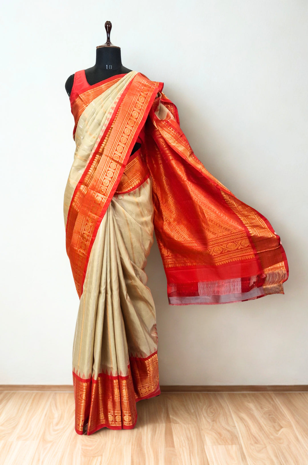 Beige silk gadwal saree with rich border