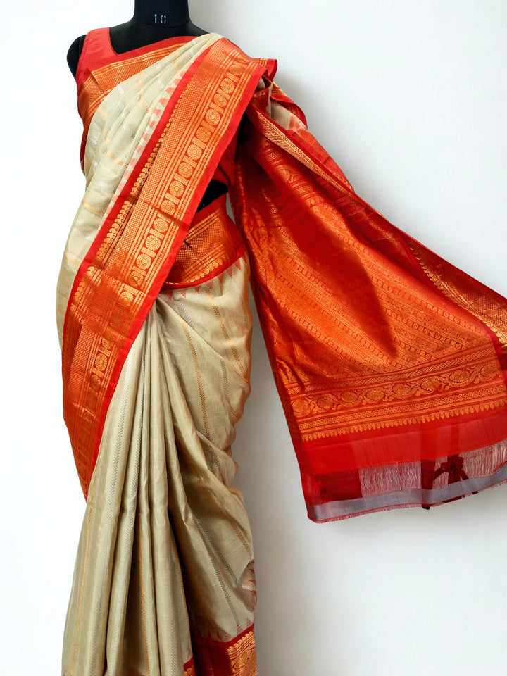 Beige silk gadwal saree with rich border
