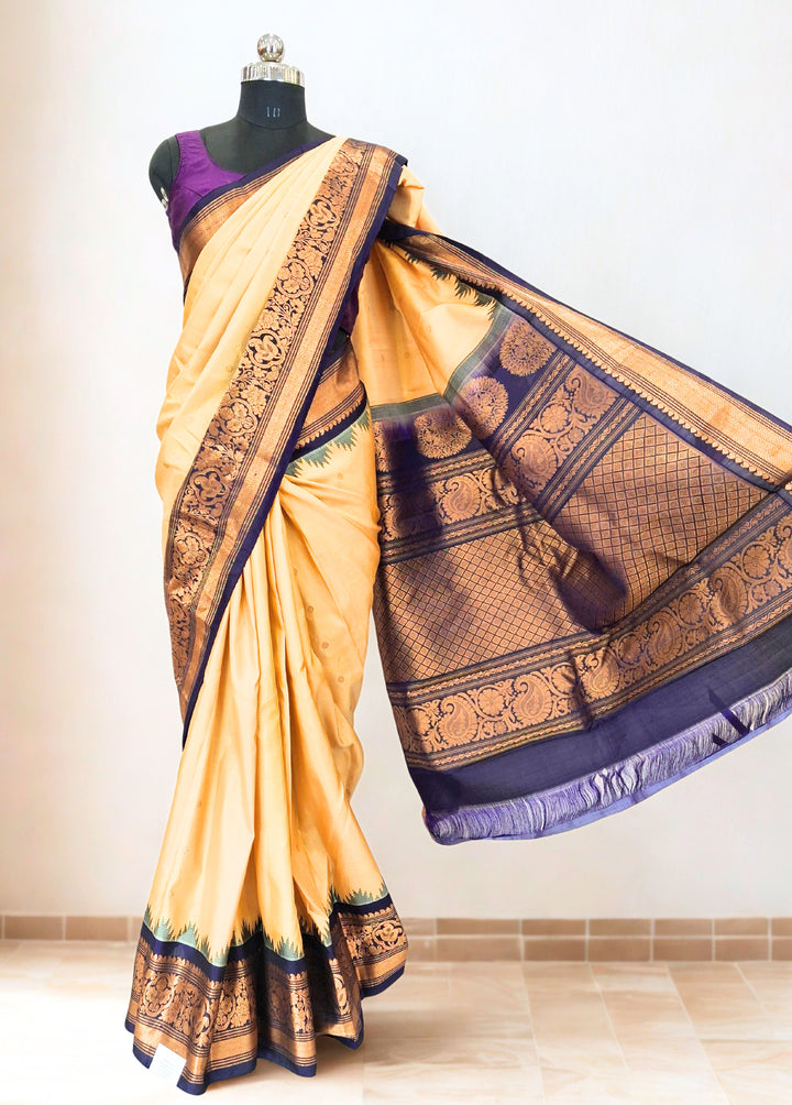 Cream gadwal silk saree with temple border