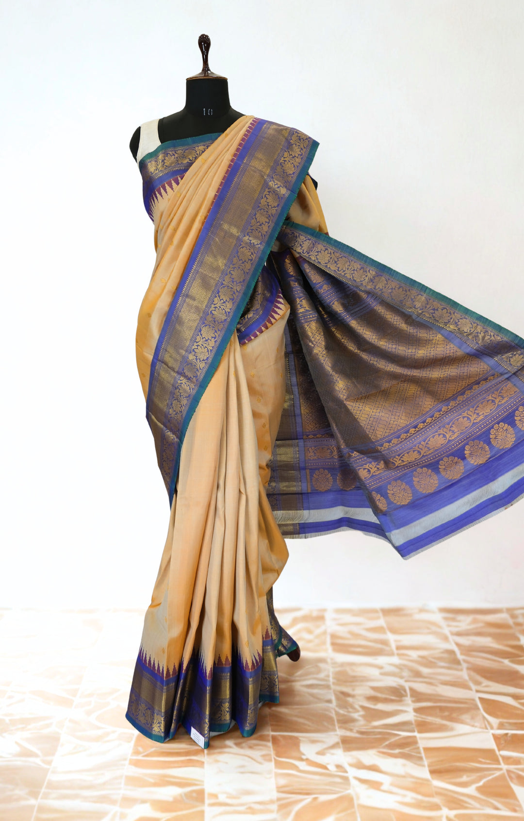 Cream gadwal silk saree with temple border