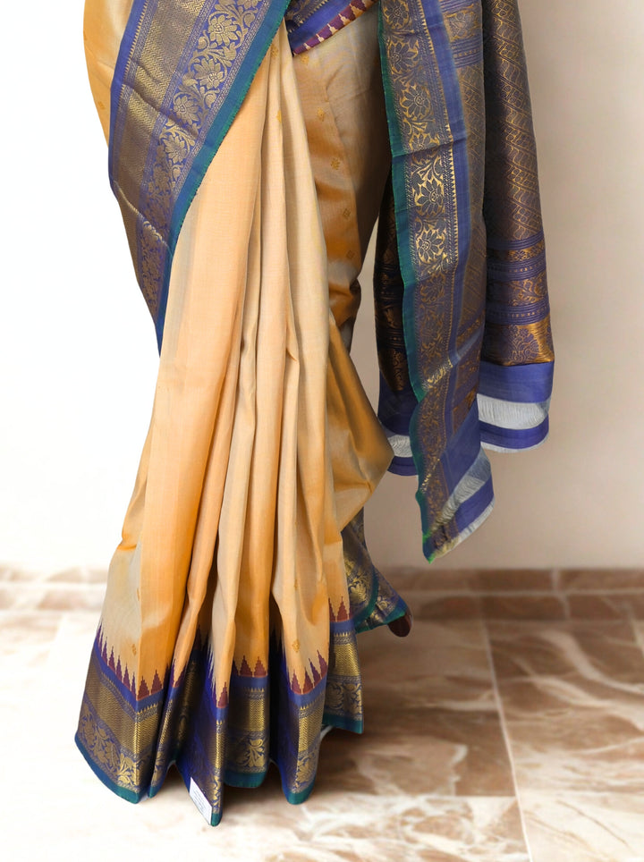 Cream gadwal silk saree with temple border