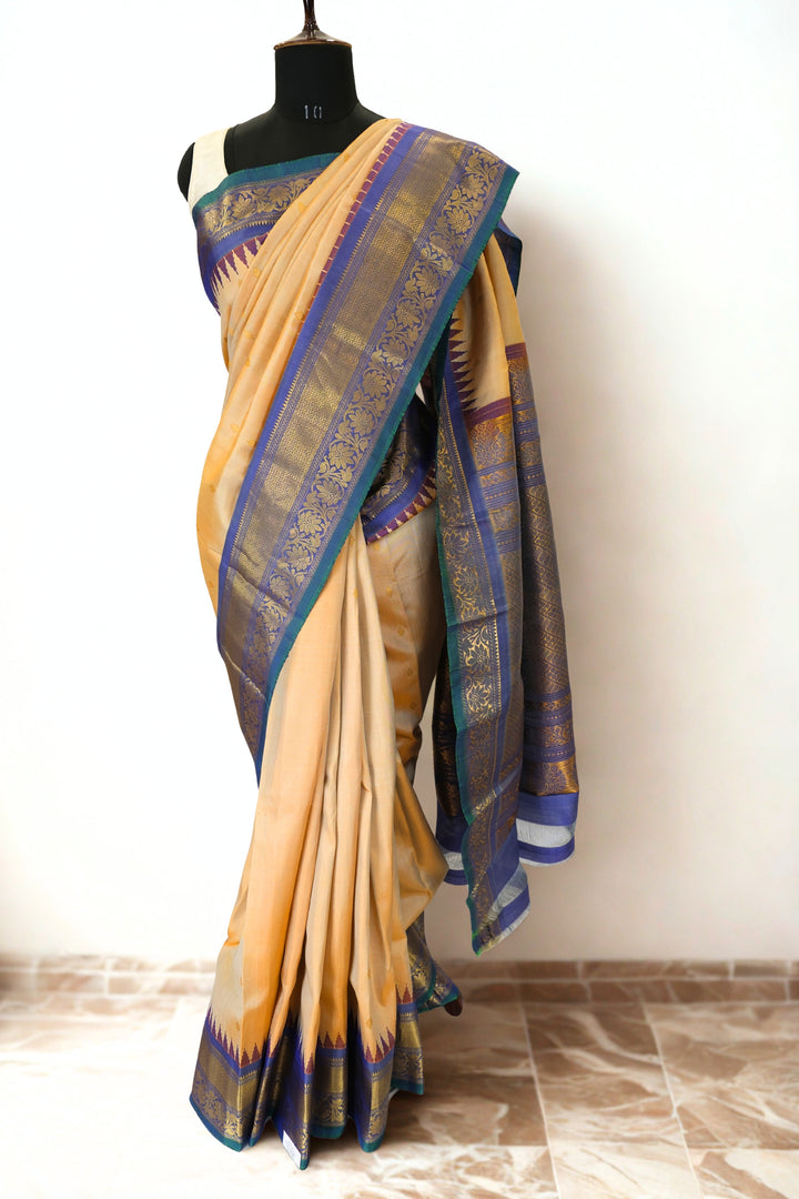 Cream gadwal silk saree with temple border