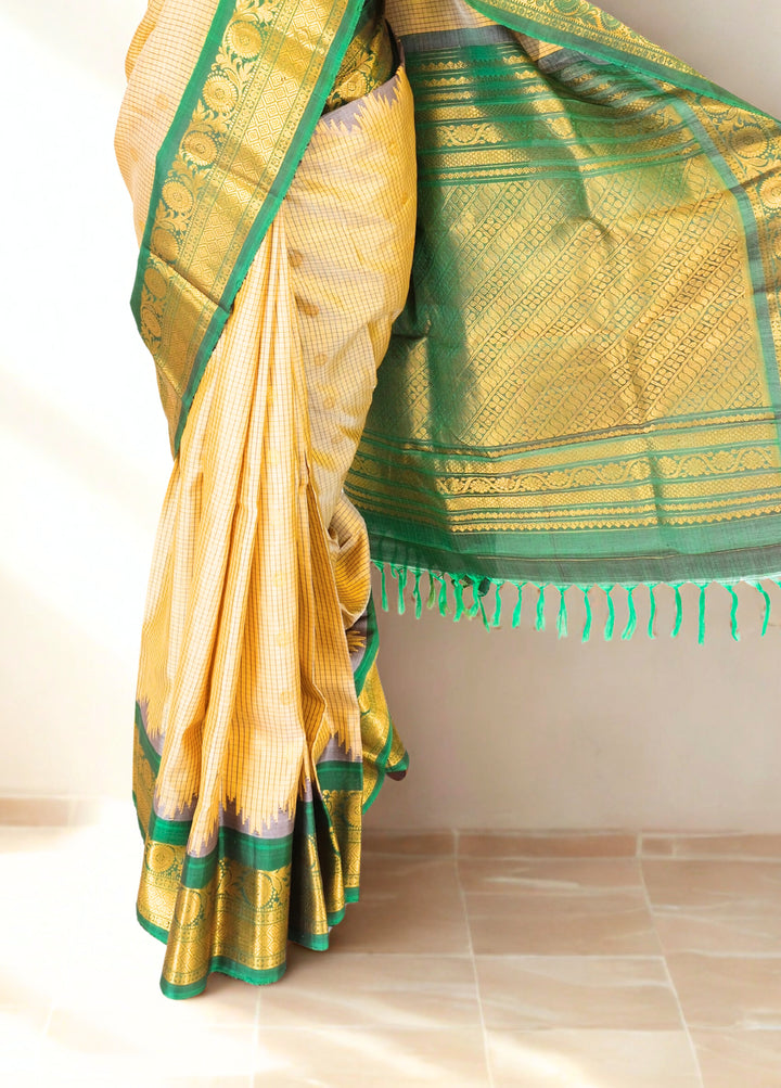 Beige checks silk gadwal saree with temple border