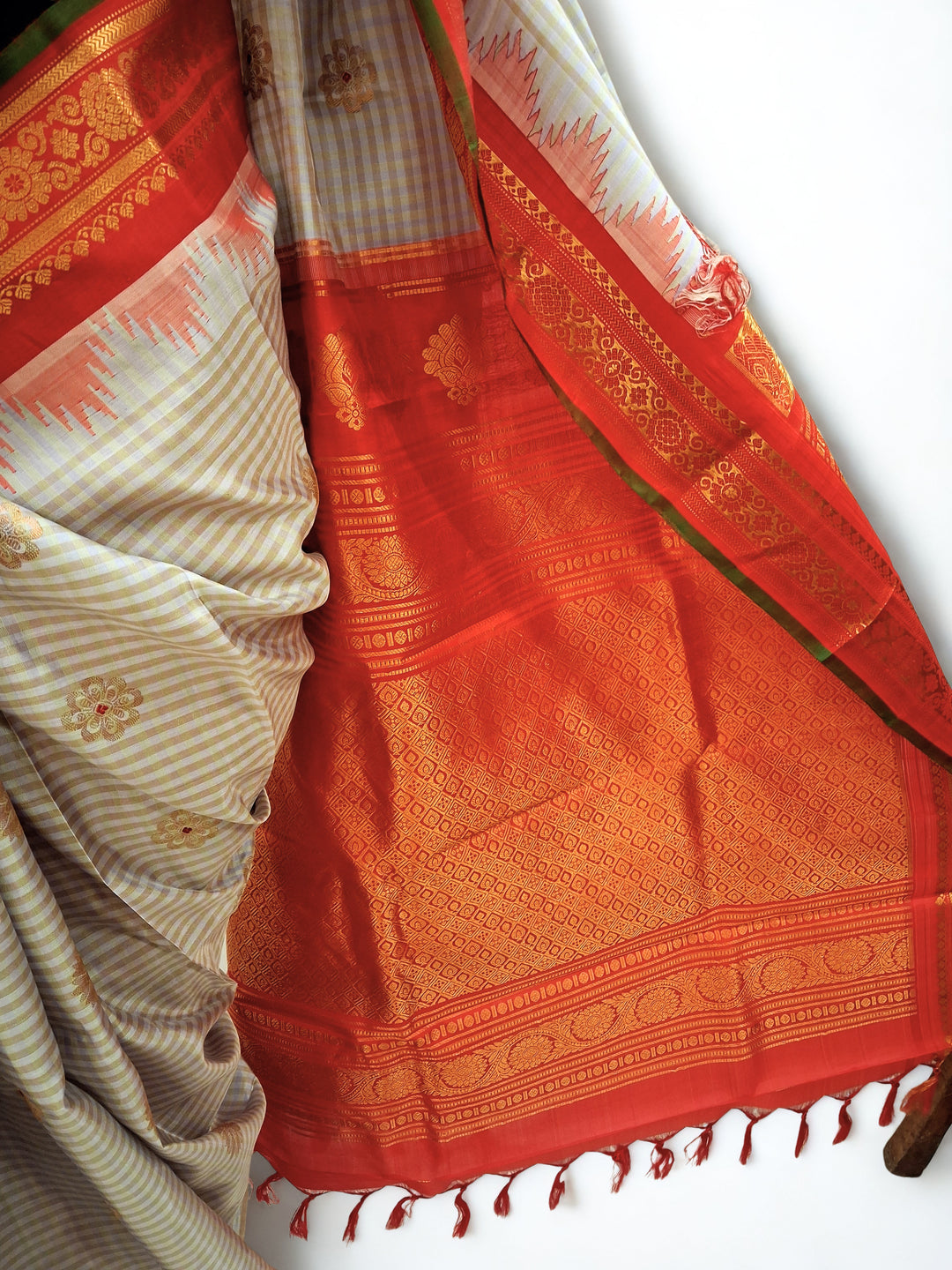Light grey gadwal silk saree with orange temple border