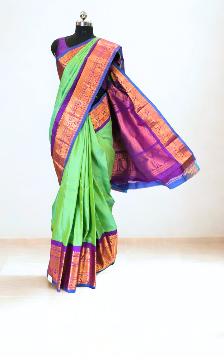 Sea green silk gadwal saree with rich border