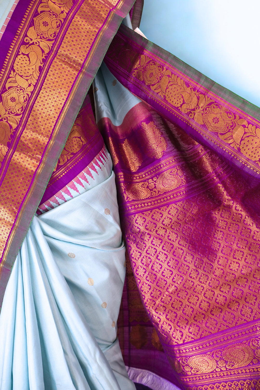 Powder blue silk gadwal saree with temple border