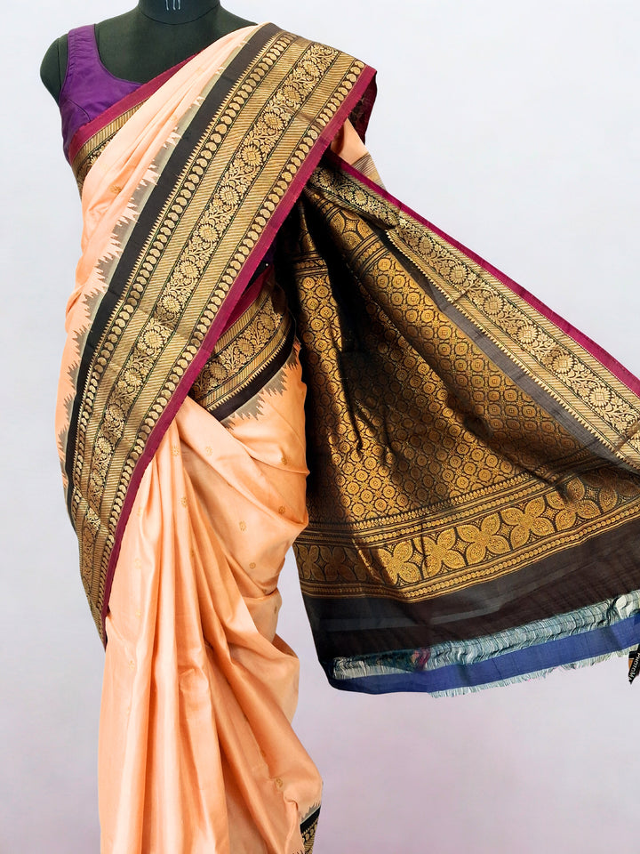 Peach silk gadwal saree with temple border