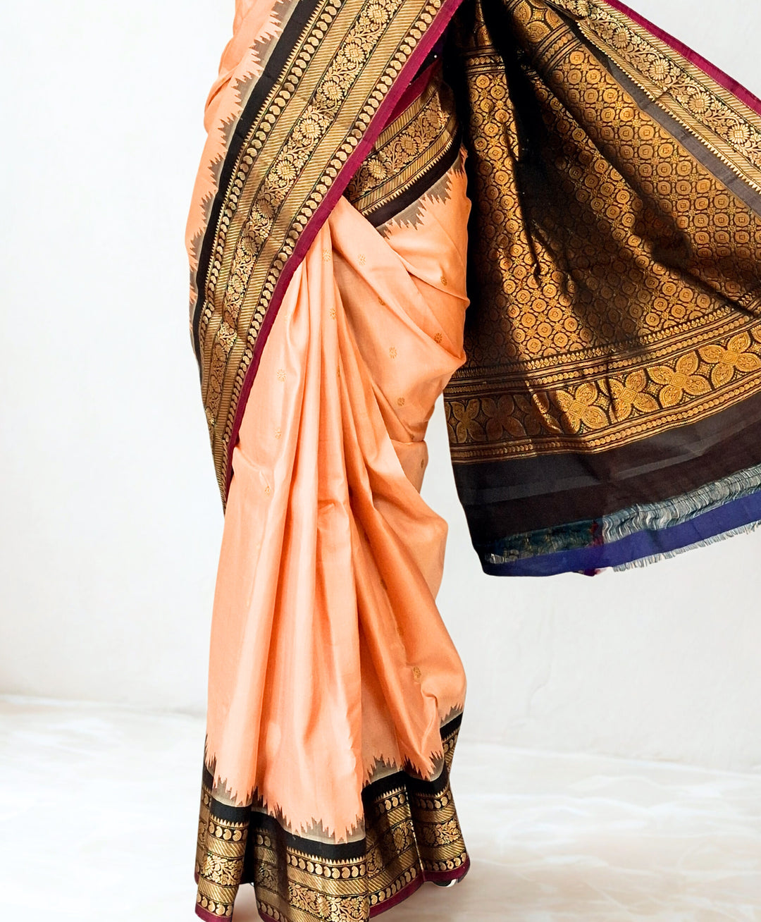 Peach silk gadwal saree with temple border