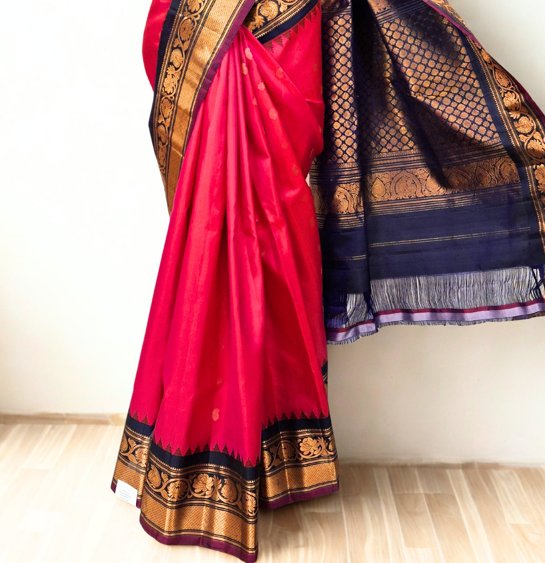 Fuchsia pink silk gadwal saree with temple border