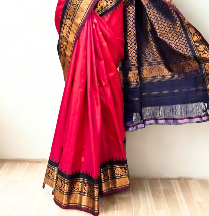 Fuchsia pink silk gadwal saree with temple border