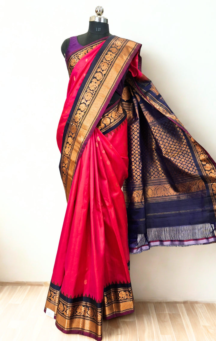 Fuchsia pink silk gadwal saree with temple border