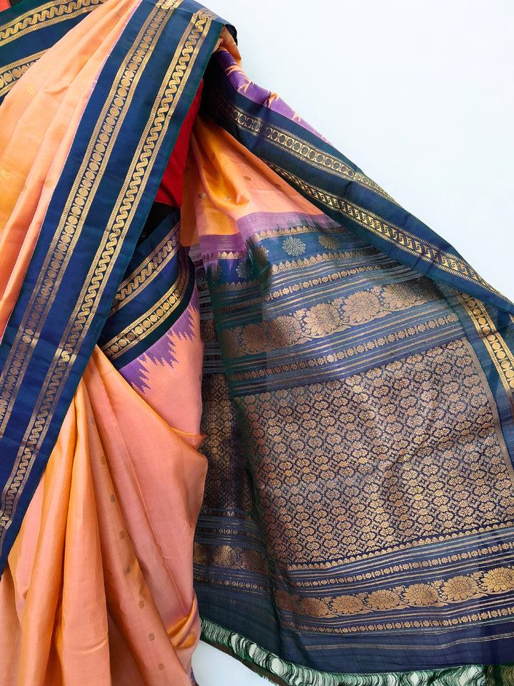 Peach gadwal silk saree with blue temple border