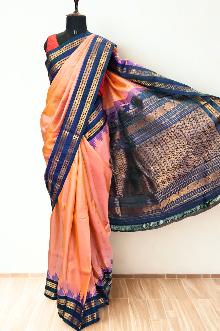 Peach gadwal silk saree with blue temple border