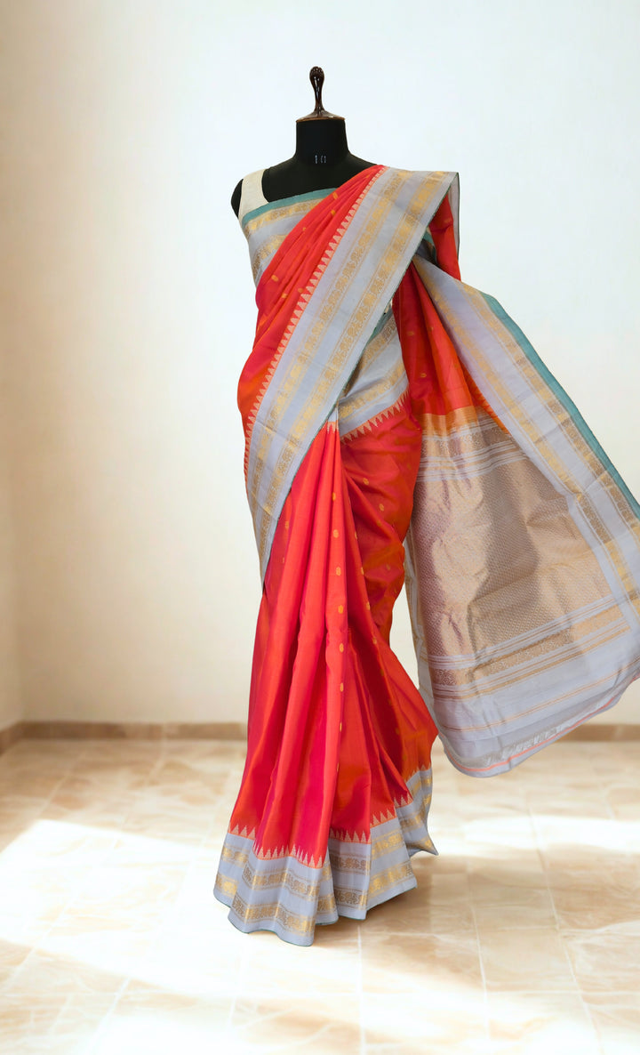 Reddish pink silk gadwal saree with temple border