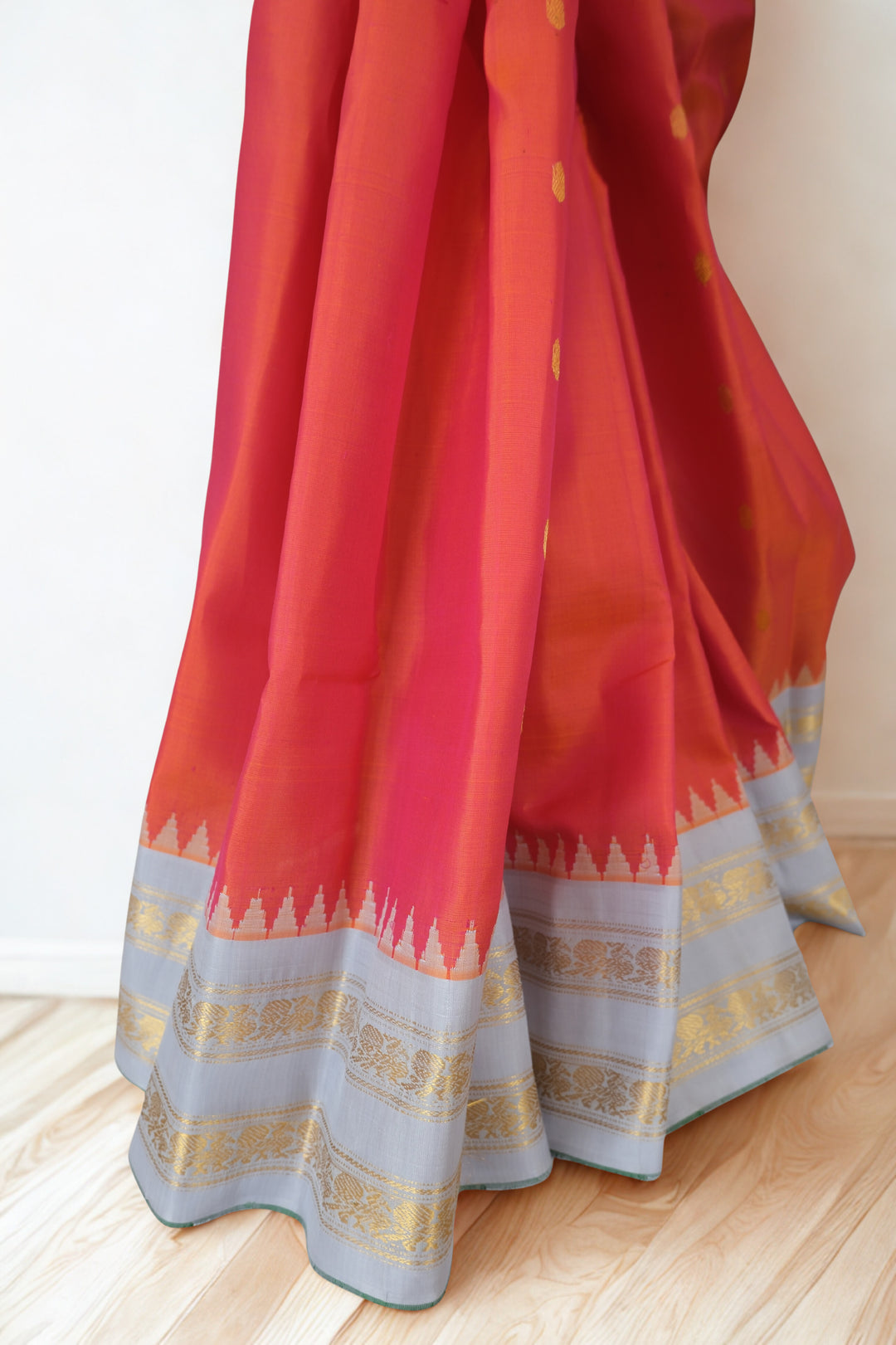 Reddish pink silk gadwal saree with temple border