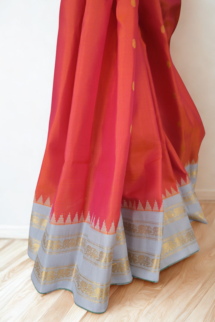 Reddish pink silk gadwal saree with temple border