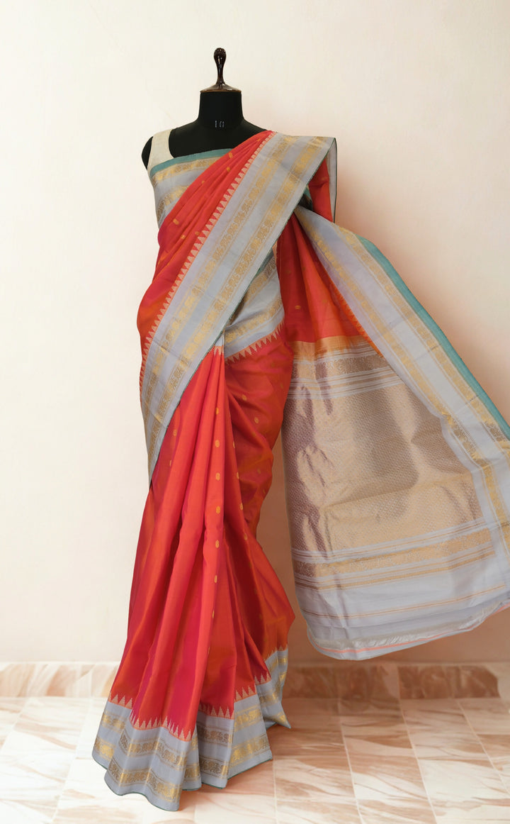 Reddish pink silk gadwal saree with temple border