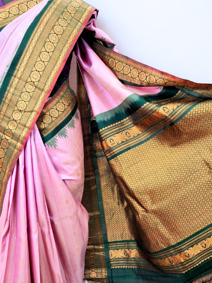 Baby pink silk gadwal saree with green temple border