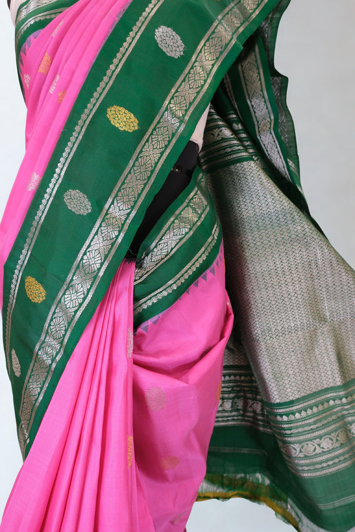 Pink gadwal silk saree with green temple border
