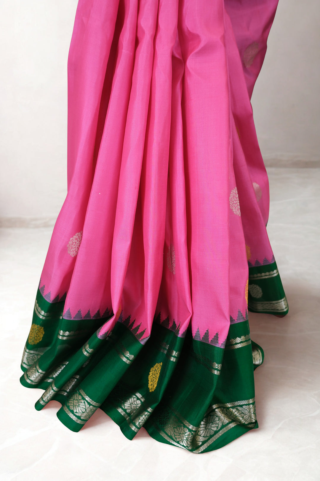 Pink gadwal silk saree with green temple border