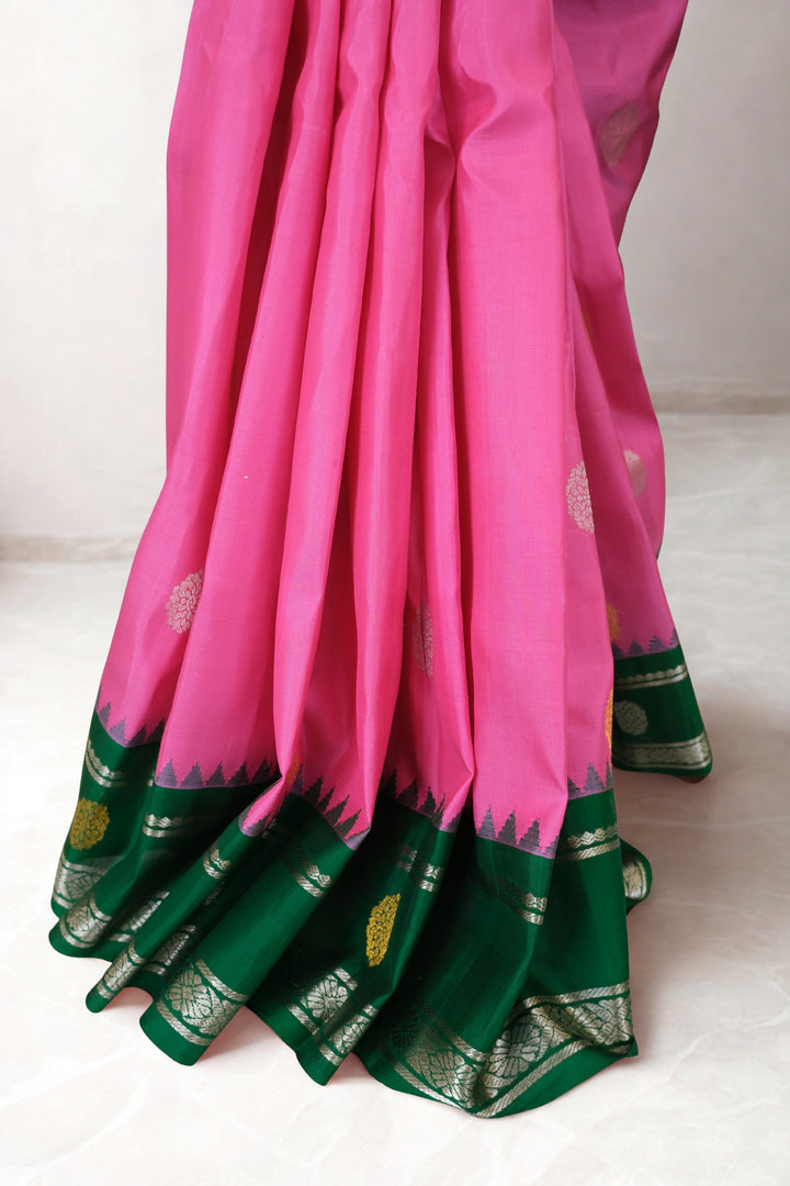 Pink gadwal silk saree with green temple border