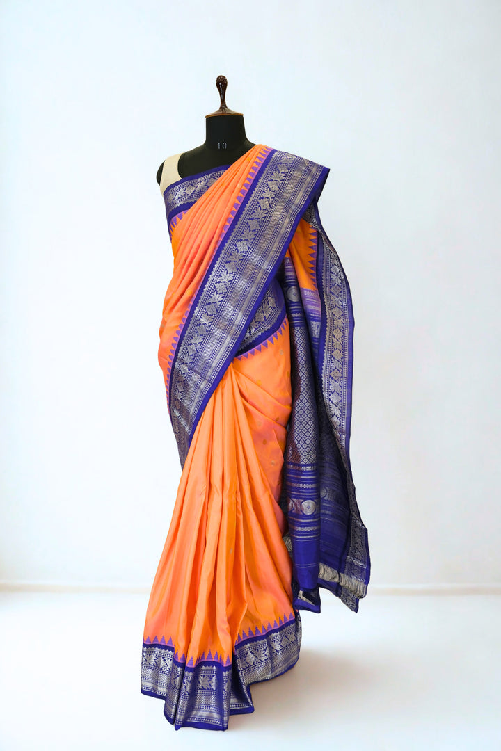 Peach gadwal silk saree with contrast blue border