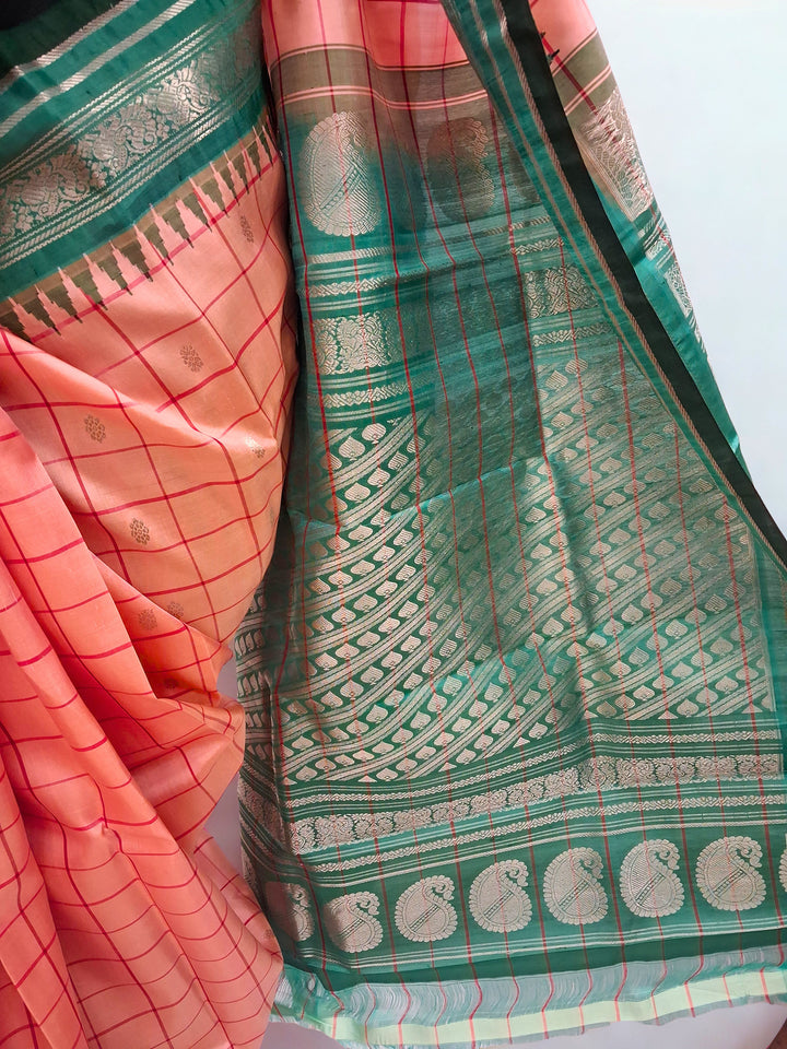 Peach silk gadwal silk saree with temple border