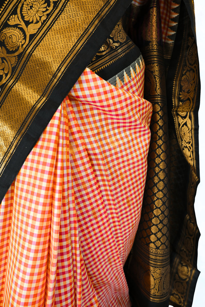 Red and peach checks silk gadwal saree with temple border