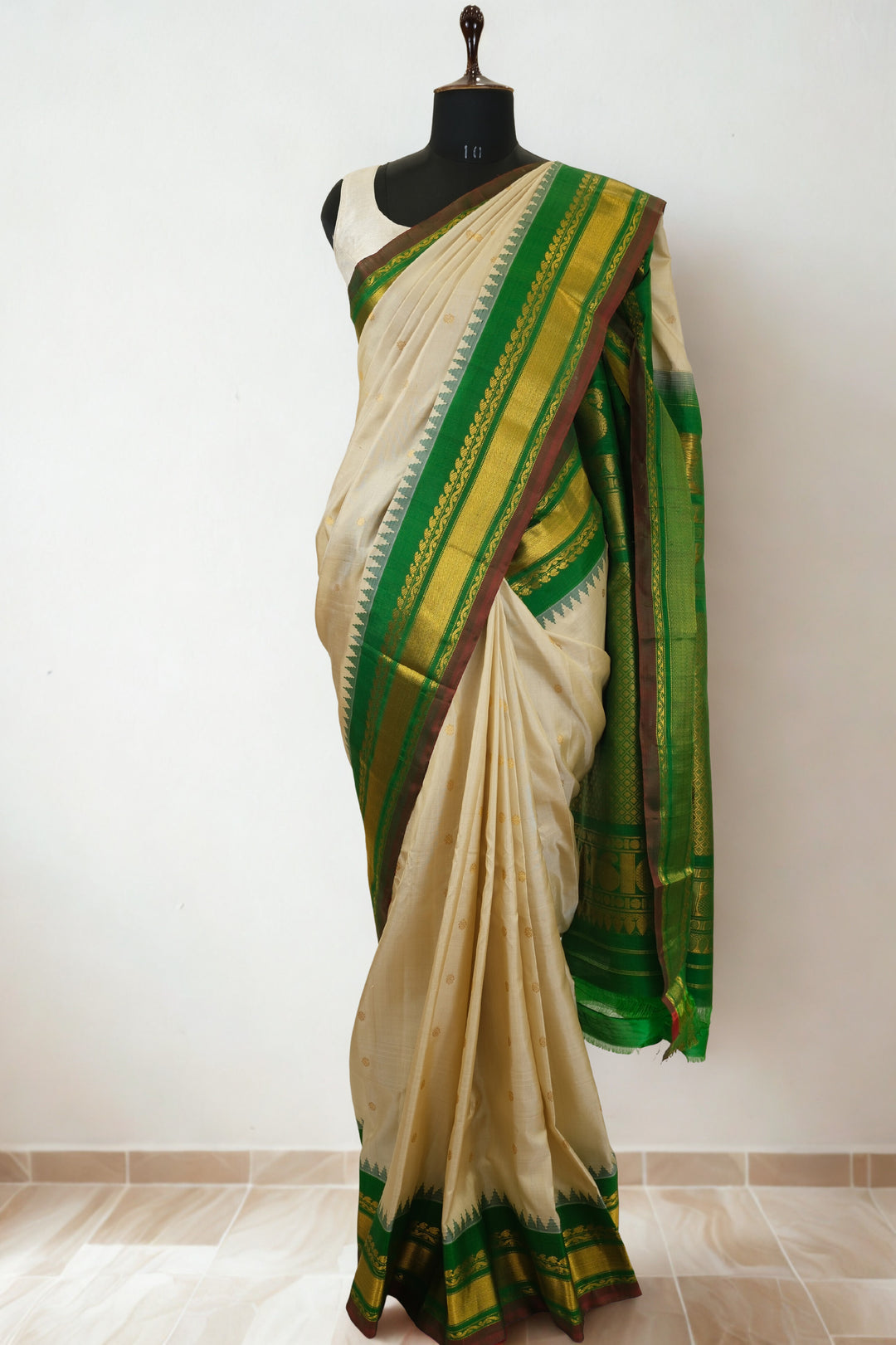 Offwhite silk gadwal saree with temple border