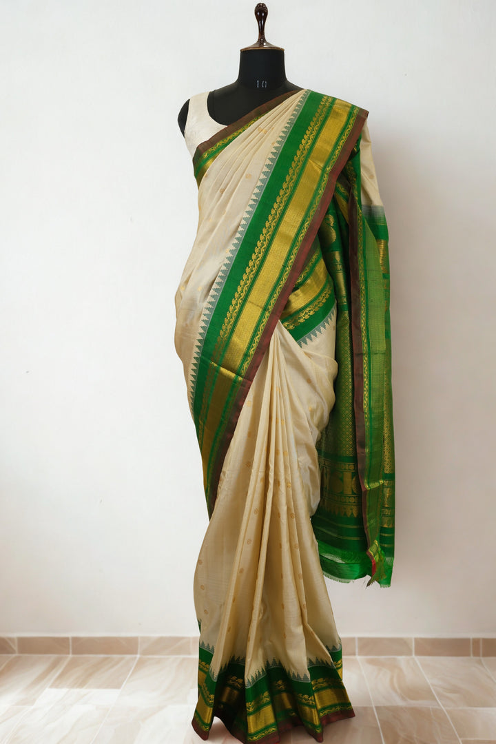 Offwhite silk gadwal saree with temple border