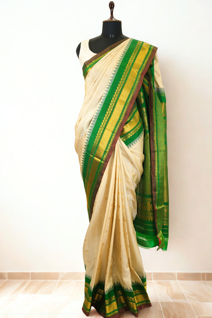 Offwhite silk gadwal saree with temple border