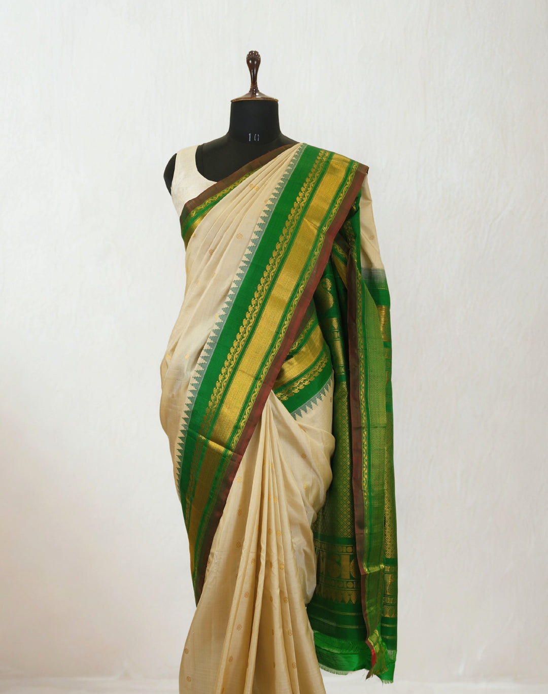 Offwhite silk gadwal saree with temple border