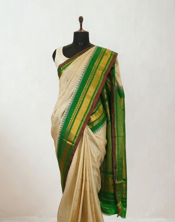 Offwhite silk gadwal saree with temple border