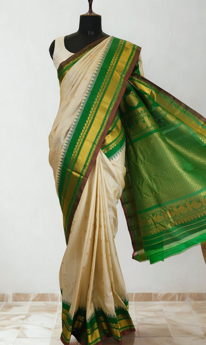 Offwhite silk gadwal saree with temple border