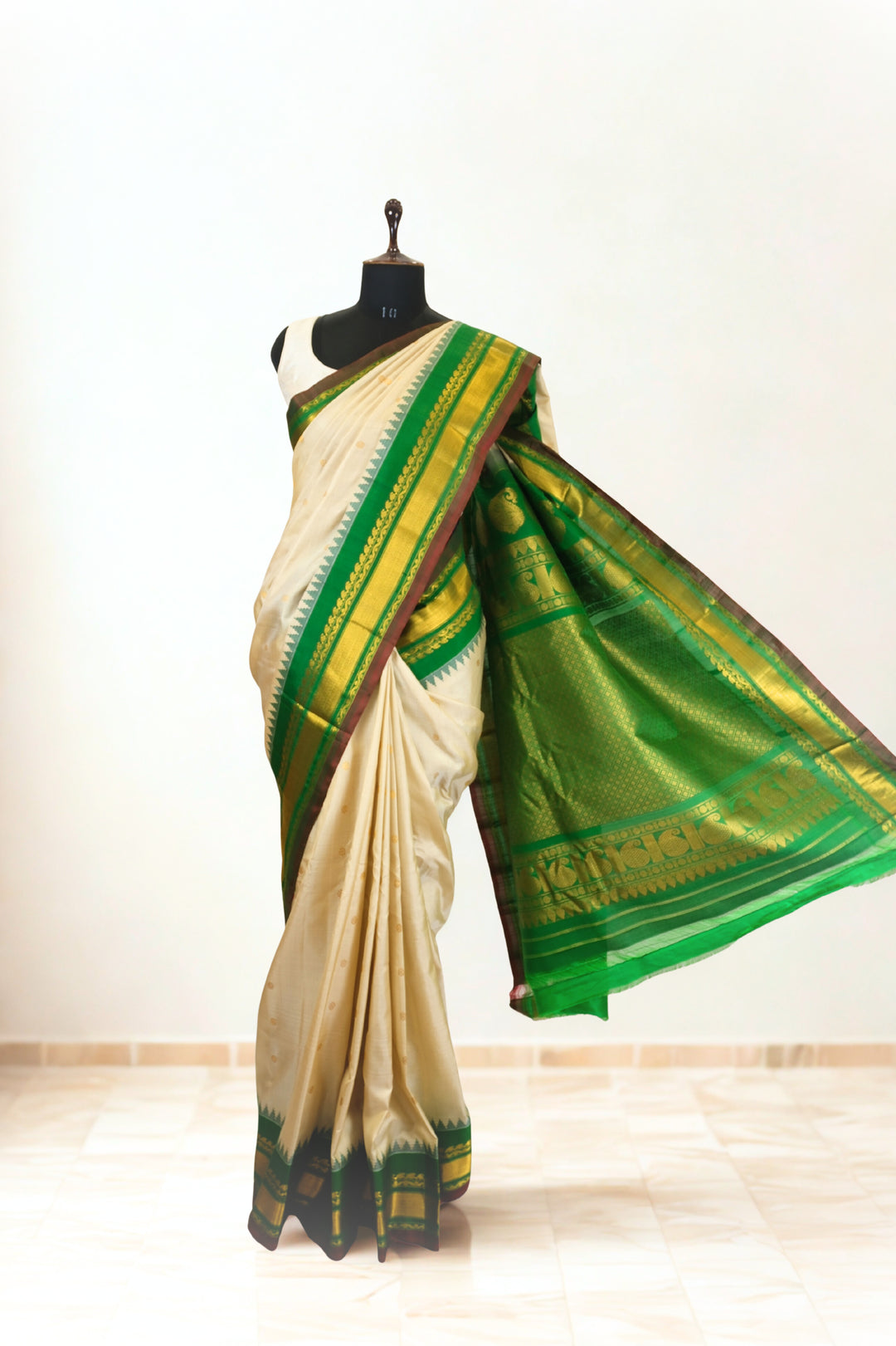 Offwhite silk gadwal saree with temple border