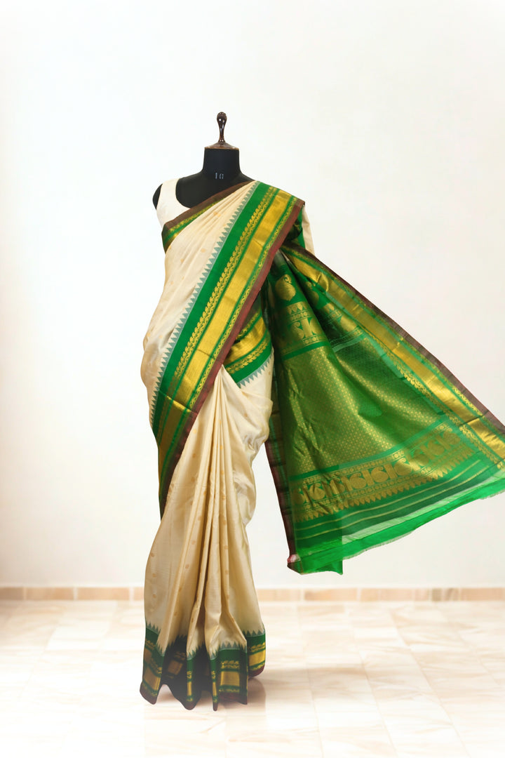 Offwhite silk gadwal saree with temple border