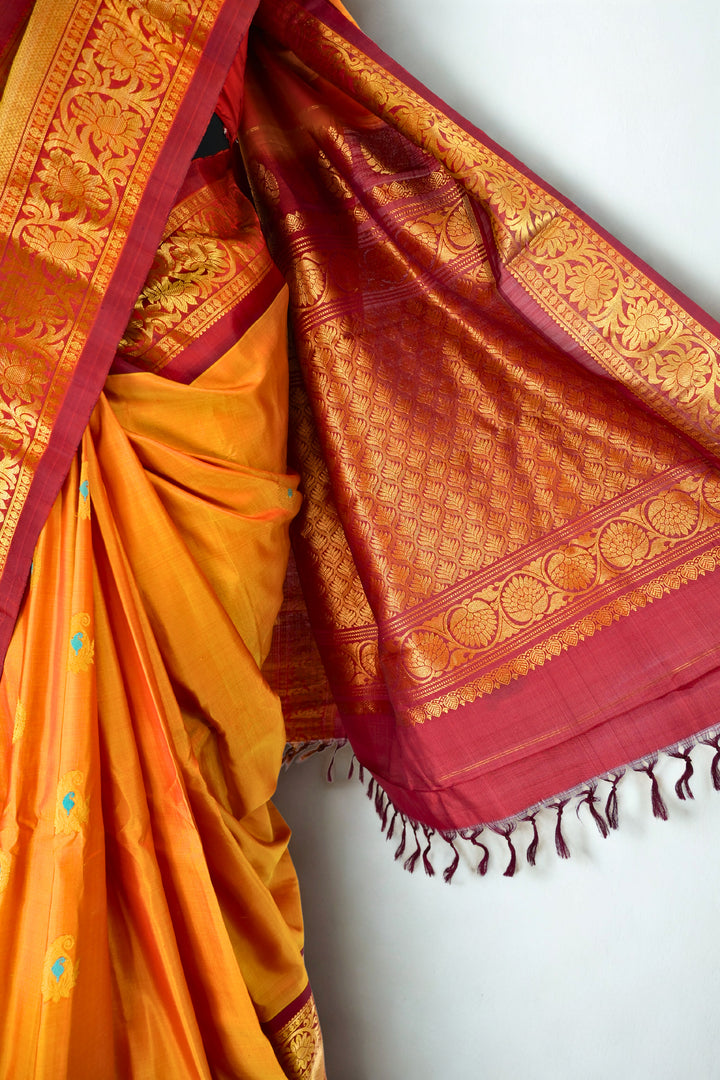 Mustard silk gadwal saree with rich border