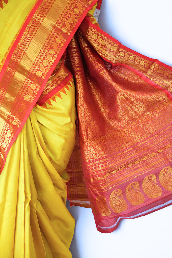 Canary yellow silk gadwal saree with temple border