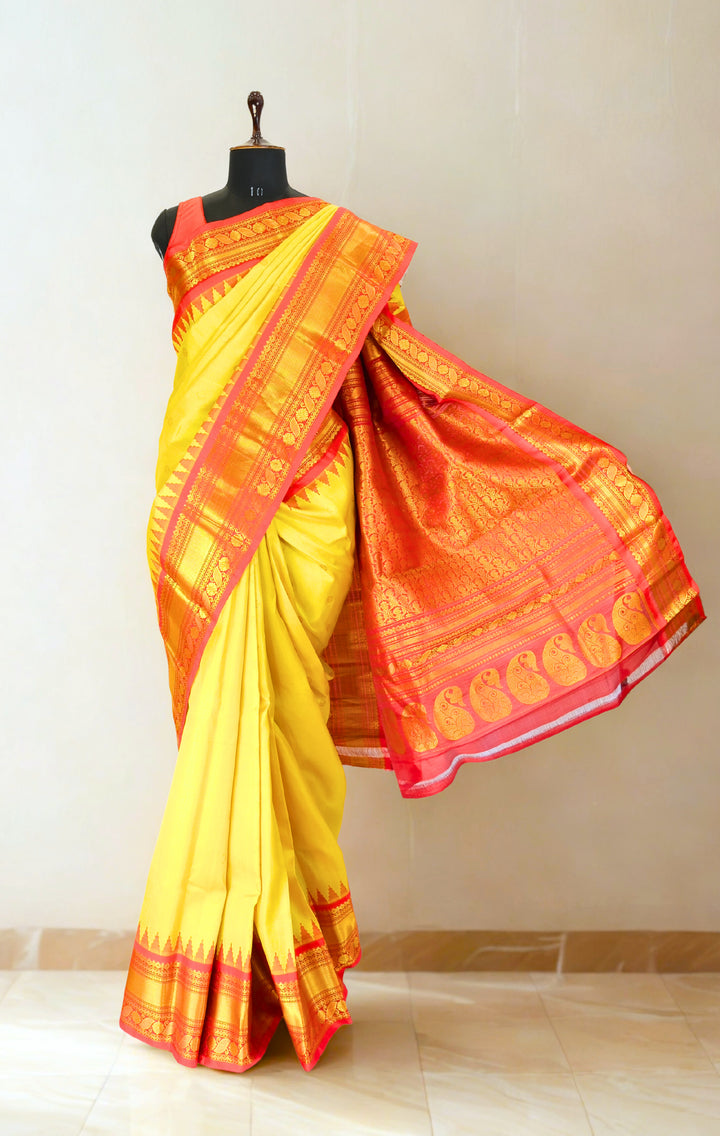 Canary yellow silk gadwal saree with temple border