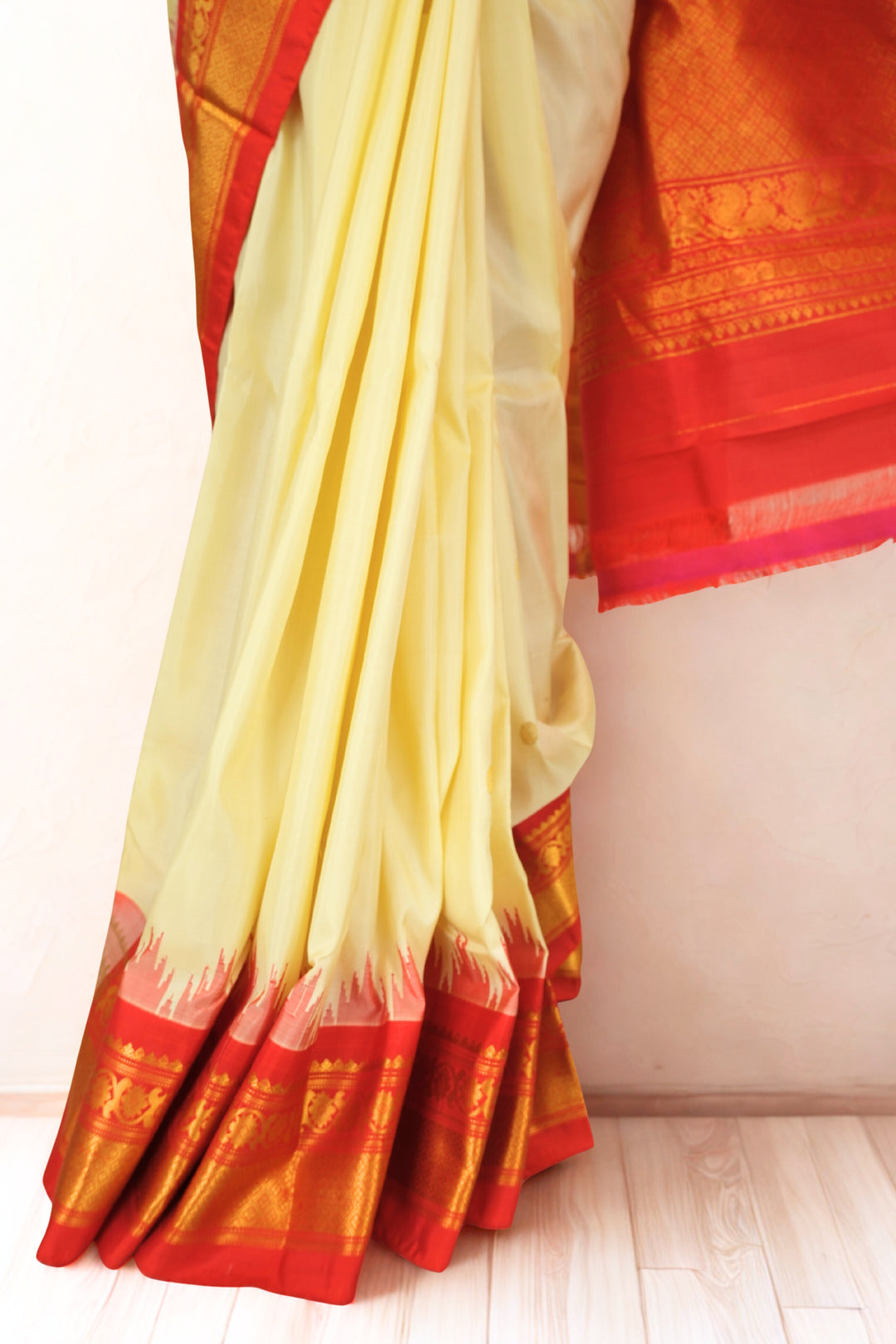 Butterscotch yellow silk gadwal saree with temple border