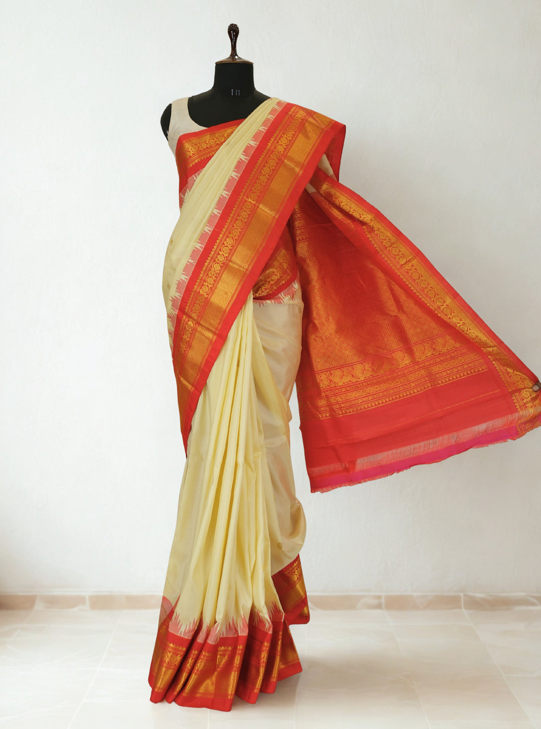 Butterscotch yellow silk gadwal saree with temple border