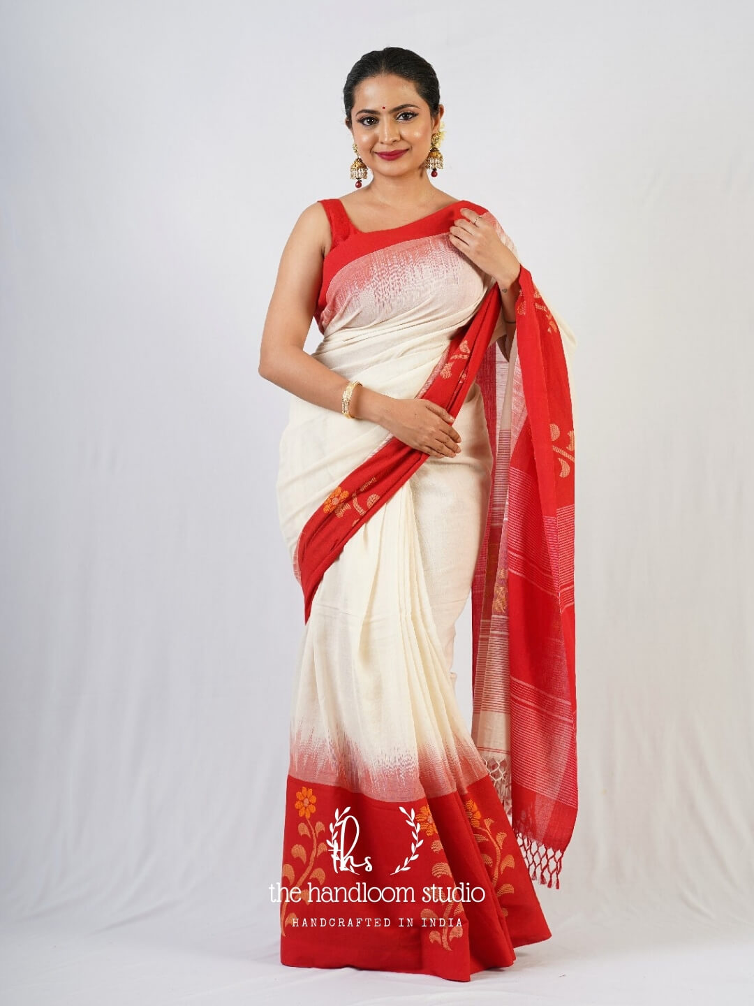 Offwhite cotton jamdani saree with rich red borders