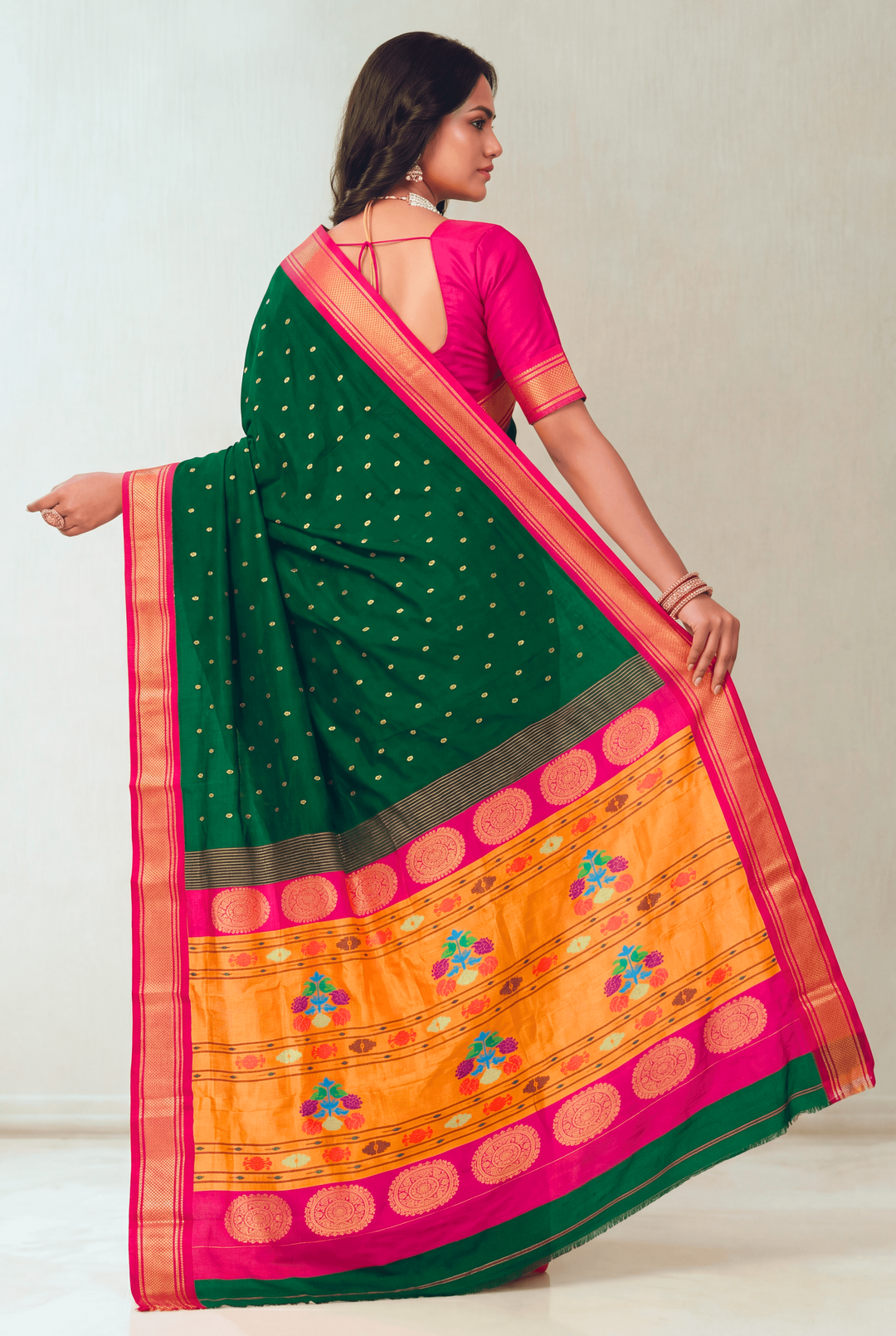 Bottle green silk paithani saree with pink border